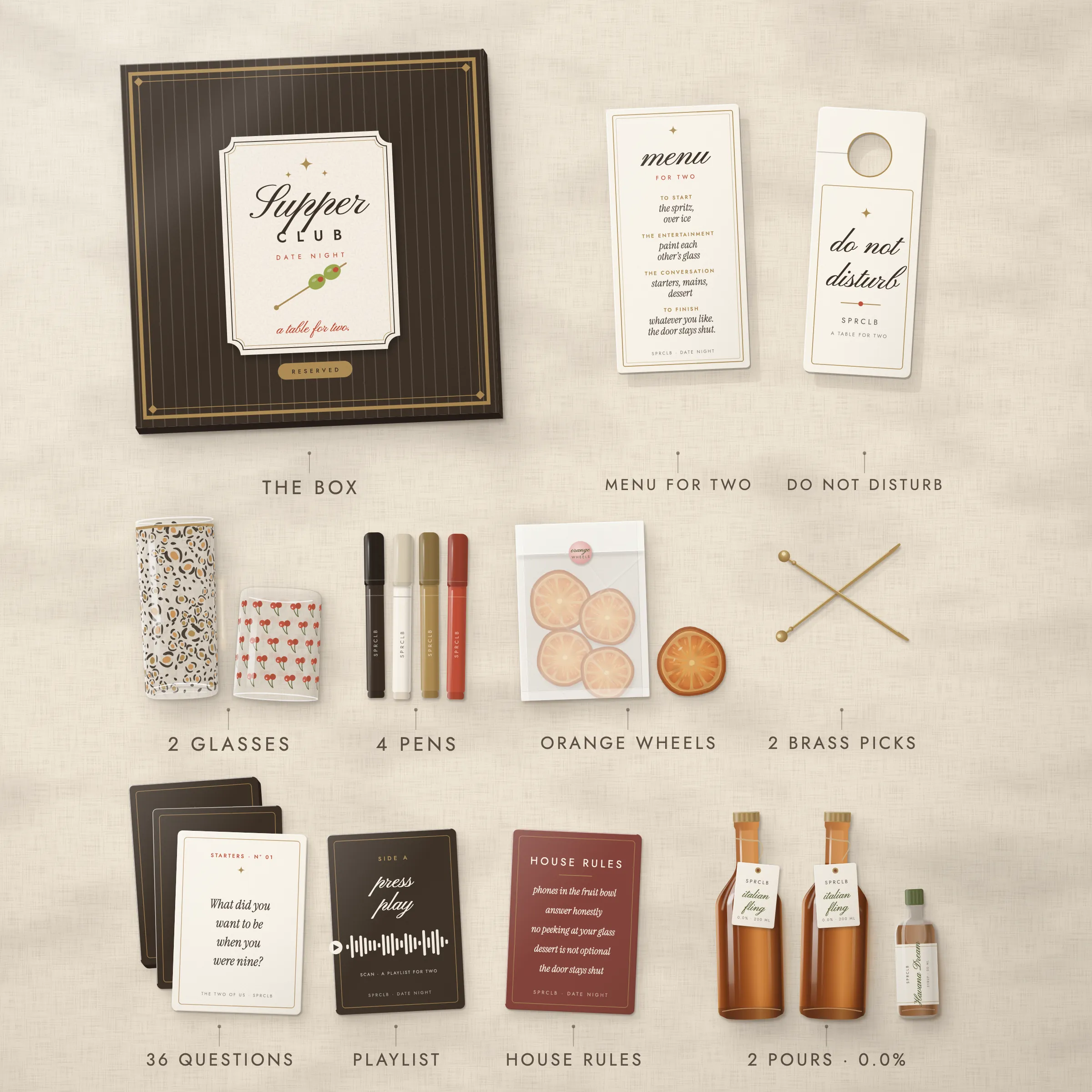 Everything in Date Night laid out from above: the espresso lid, a highball and a rocks glass, four pens, the 36-question deck in three courses, a menu for two, a playlist card, a door hanger, brass picks, orange wheels and two pours