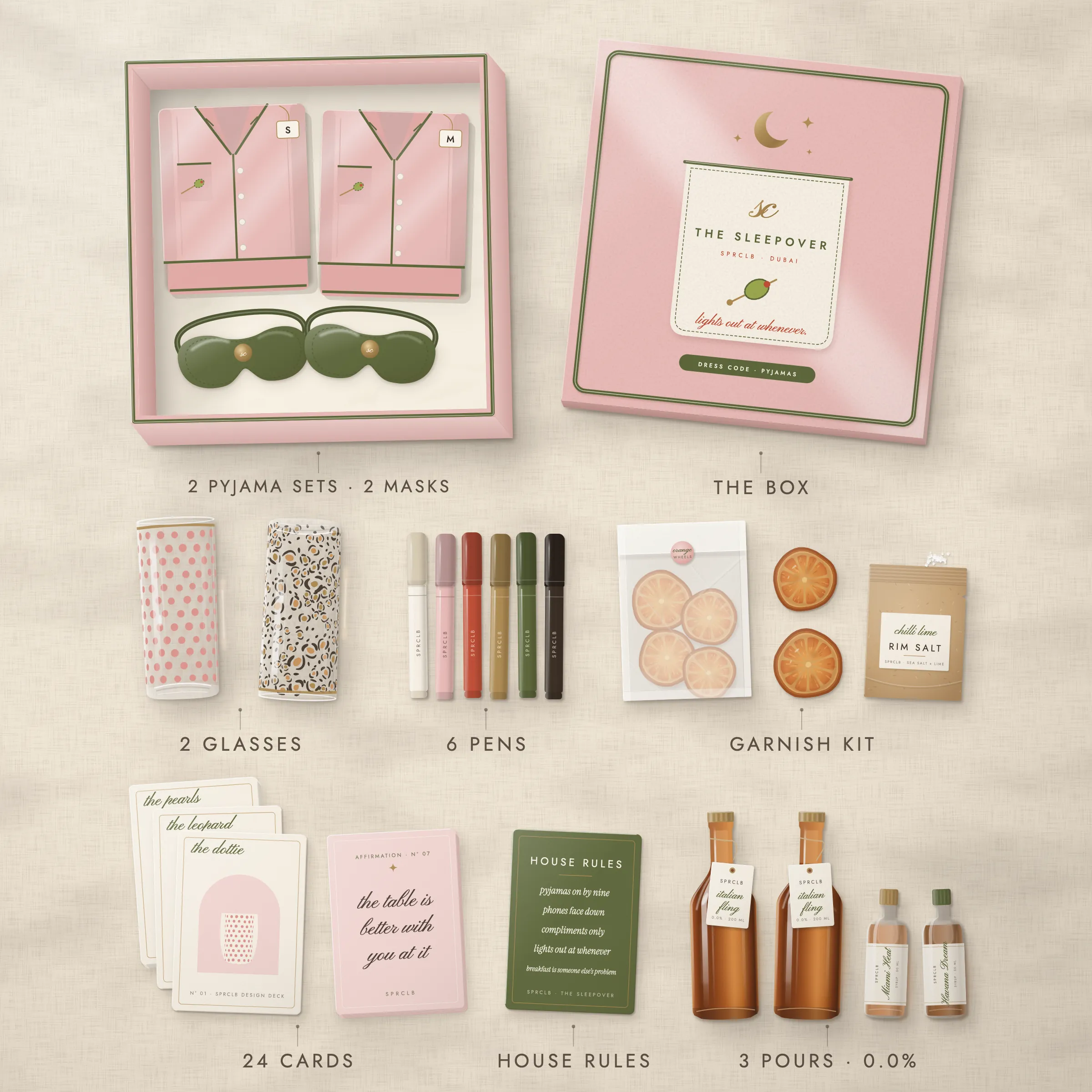 Everything in The Sleepover laid out from above: the pocket lid, two folded blush pyjama sets with olive piping, two olive eye masks, two glasses, six pens, the card decks, the garnish kit and the three pours