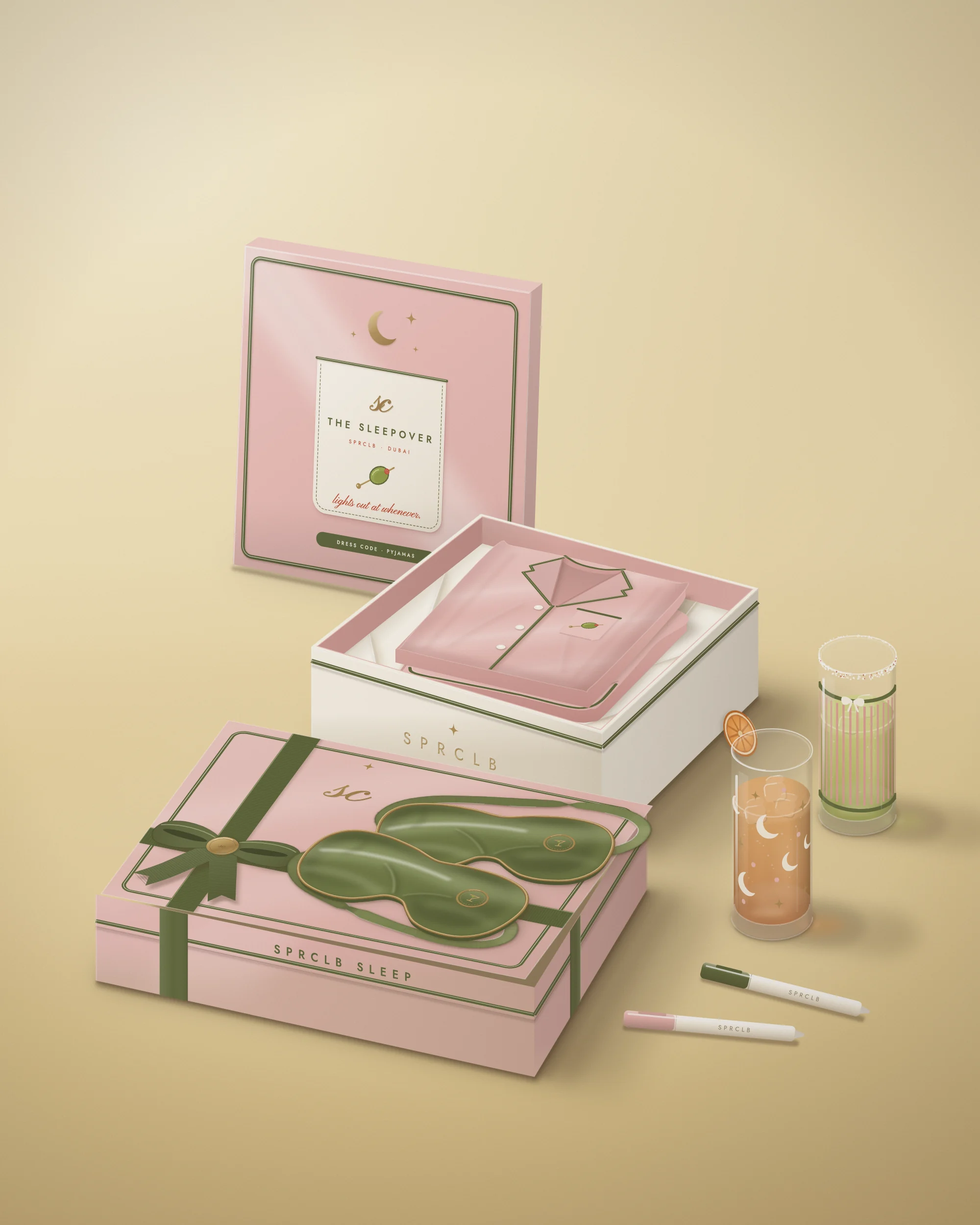 The Sleepover: the blush satin box with its olive-piped pocket lid propped behind, a pyjama box tied on with olive ribbon, matching blush pyjamas folded in tissue, olive satin eye masks and two painted glasses on a butter-yellow backdrop